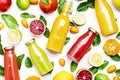 Citrus fruit juice bottles, food background. Summer drinks and beverages. Mix of different whole and cut fruits: orange, Royalty Free Stock Photo