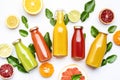 Citrus fruit juices, fresh and smoothies, food background, top view. Mix of different whole and cut fruits: orange, grapefruit, Royalty Free Stock Photo