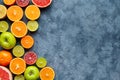 Citrus fruit mix on dark grey concrete table. Food background. Healthy eating. Antioxidant, detox, dieting, clean eating Royalty Free Stock Photo