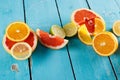 Citrus fruits against a blue wooden table Royalty Free Stock Photo