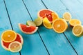 Citrus fruits against a blue wooden table Royalty Free Stock Photo