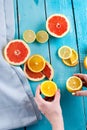 Citrus fruits against a blue wooden table Royalty Free Stock Photo