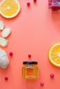 Citrus fruits, ginger, honey and cranberries on the orange background. Health food to boost immune system Royalty Free Stock Photo
