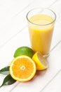 Citrus fruits and glass of juice. Orange, lime and lemon. Royalty Free Stock Photo