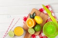 Citrus fruits and glass of juice. Oranges, limes and lemons Royalty Free Stock Photo