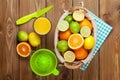 Citrus fruits and glass of juice. Oranges, limes and lemons Royalty Free Stock Photo