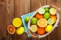 Citrus fruits and glass of juice. Oranges, limes and lemons Royalty Free Stock Photo