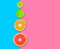 Citrus fruits, grapefruit slices, orange, lemon and kiwi pink blue background .Healthy food concept. flat lay. Top view