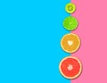 Citrus fruits, grapefruit slices, orange, lemon and kiwi pink blue background .Healthy food concept. flat lay. Top view