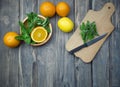 Citrus fruits and mint on a cutting board. Fresh summer citrus Royalty Free Stock Photo