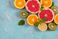 Citrus fruits with orange, lemon, grapefruit and lime on blue background Royalty Free Stock Photo