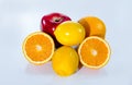 Citrus fruits orange, lemon, red apple and banana Royalty Free Stock Photo