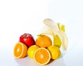 Citrus fruits orange, lemon, red apple and banana Royalty Free Stock Photo