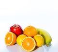 Citrus fruits orange, lemon, red apple and banana Royalty Free Stock Photo