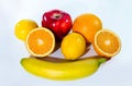 Citrus fruits orange, lemon, red apple and banana Royalty Free Stock Photo