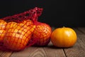 Citrus Fruits Tangerine in Oranges in plastic net bag package. no plastic concept. Packaging that does not recycle. Plastic. Rusti