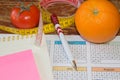 Citrus fruits, tomato. Measure tape and fresh fruit in the background. Healthy lifestyle diet with fresh fruits Royalty Free Stock Photo