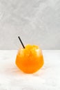 Citrus Granizado drink, iced Orange Juice in drinking glass. Sweet fruit Shaved ice. Refreshing Slushie iced drink Royalty Free Stock Photo