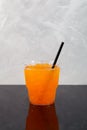 Citrus iced slush or Orange Granizado in disposable plastic take away cup. Sweet fruit Shaved ice. Refreshing Slushie drink Royalty Free Stock Photo