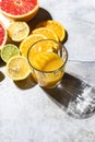 Citrus juice and fresh fruit, lime, grapefruit, orange, lemon in sunlight. Detox drink. Royalty Free Stock Photo