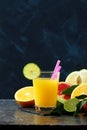 Citrus juice fruit or smoothies on dark background Royalty Free Stock Photo