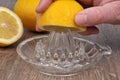 Make a lemon juice with a juicer close-up Royalty Free Stock Photo