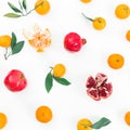 Citrus with leaf and red garnet on white background. Flat lay. Top view