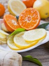 Citrus - Lemon, lime, mandarine and ginger fresh slices for a delicious drink Royalty Free Stock Photo