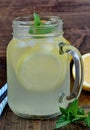 Citrus lemonade with mint in mason jar Royalty Free Stock Photo