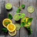 Citrus orange cold drink with mint on an old wooden background with mint and slices of lime and lemon Royalty Free Stock Photo