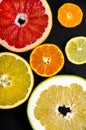 Citrus round slices on black background