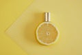 citrus scent, perfume with lemon scent concept, lemon with spray bottle on yellow background
