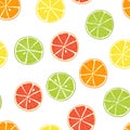Citrus seamless pattern. Slices of lime, orange, grapefruit, lemon. Bright pieces on white background. Candy sweet Royalty Free Stock Photo