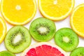 Citrus slices - kiwi, oranges and grapefruits on white background. Fruits backdrop