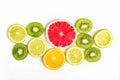 Citrus slices - kiwi, oranges and grapefruits on white background. Fruits backdrop. Royalty Free Stock Photo