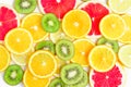 Citrus slices - kiwi, oranges and grapefruits on white background. Fruits backdrop Royalty Free Stock Photo