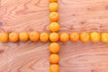 Citrus tankan cross against wooden background