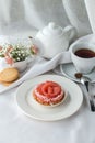 Citrus tartelettes dessert with cream and grapefruit with cup of tea on the table Royalty Free Stock Photo