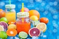 Citrus vitamin juice with fresh fruits around Royalty Free Stock Photo