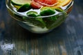 Citrus in water with bubbles in transparent plate Oranges, lemon