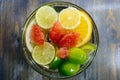 Citrus in water with bubbles in transparent plate Oranges, lemon