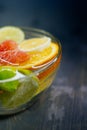 Citrus in water with bubbles in transparent plate Oranges, lemon