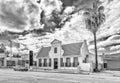 Historic bank building and a vehicle in Citrusdal. Monochrome