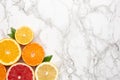 Citruses on marble background with copyspace , fruit flatlay, summer minimal compositon with grapefruit, lemon, mandarin and Royalty Free Stock Photo
