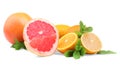 Citruses and mint leaves on a white background. Different exotic fruits: grapefruit, orange, and lemon. Vitamin C.