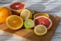 Citruses on a wooden board Royalty Free Stock Photo
