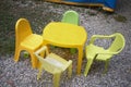 Yellow plastic chairs in a garden Royalty Free Stock Photo