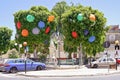 City alley decorated with colored umbrellas to celebrate summer festival