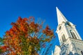 City ancient building with foliage trees and blue sky in Manchester, Vermont