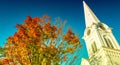 City ancient building with foliage trees and blue sky in Manchester, Vermont